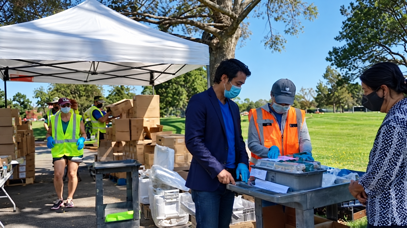 NamQuan Nguyen assisting volunteers and residents at a COVID-19 food distribution