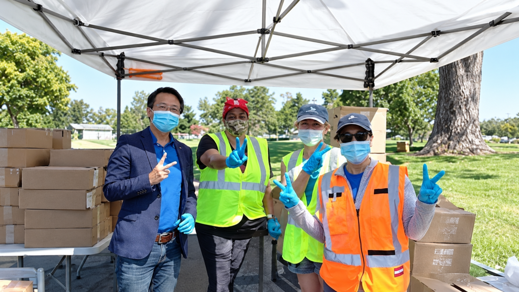 NamQuan Nguyen with volunteers at a community food giveaway during the COVID-19 pandemic
